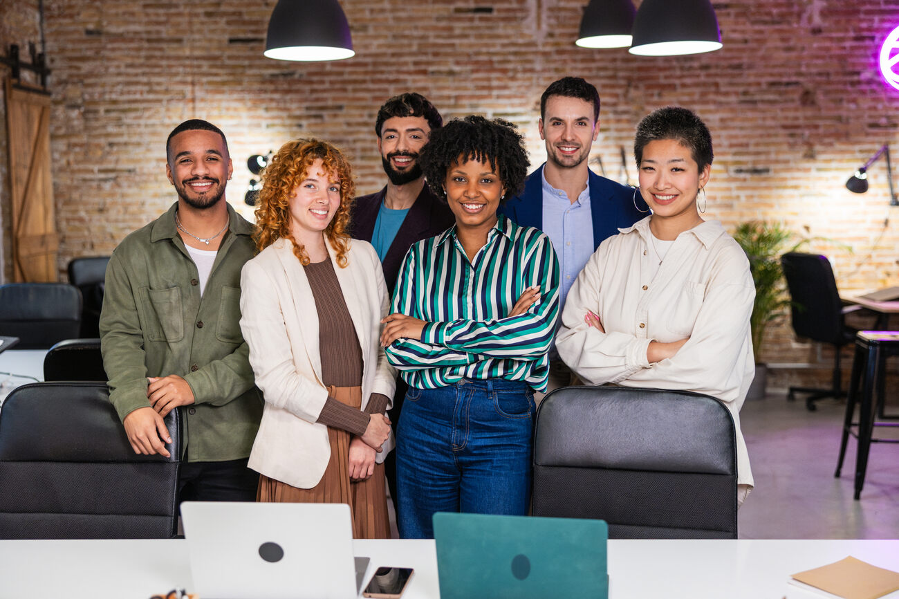 multi-ethnic-team-of-professionals-smiling-in-mode-AQ63QP3.jpg